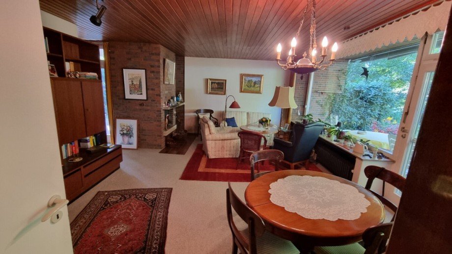 Wohnzimmer mit Kamin Einfamilienhaus Lachendorf